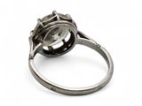 a silver ring with a diamond in it