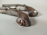 two old tools that are laying on a table