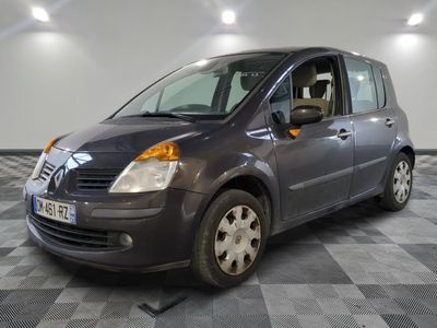 a picture of a small grey van parked in a garage