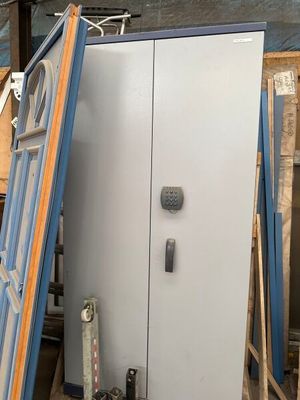two doors that are leaning against a wall in a room