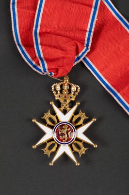 a close up of a medal with a ribbon around it