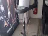 a hair dryer that is on a stand in a room