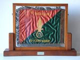 an image of a wooden display case with a flag on top of it