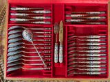 silverware in a red box with spoons and spoons in it