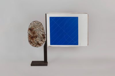 an image of a sculpture of a tree with a blue square in the background