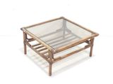 a glass coffee table with a wooden frame and glass top