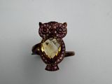 an image of an owl ring with a face made out of a stone