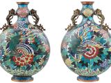 pair of chinese cloise vases with birds and flowers painted on them