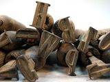 a pile of old metal objects on a white surface