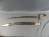 pair of two old swords with metal handles on a white cloth