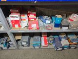 many boxes of electronic equipment on a shelf