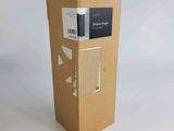 a box with a book inside of it on a white surface
