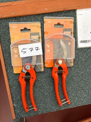 two pliers that are attached to a bulletin board