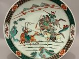 an image of a plate with a picture of a man riding a horse