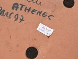 a picture of a sign on the wall of a building with writing on it