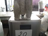 a picture of a mop on top of a machine in a store