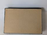 an image of a brown and black box sitting on top of a white table