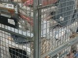a large metal cart with many items in it