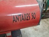 a red fire extinguisor sitting in a garage