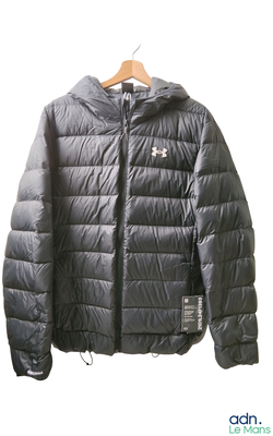 a black jacket hanging on a hanger on a white wall
