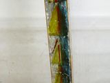 a glass vase with flowers in it sitting on a table