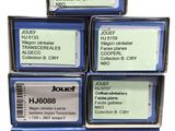 four boxes of different types of ink cartridges on a white background