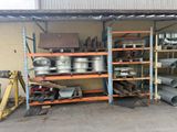 a garage with a lot of metal items on the shelves