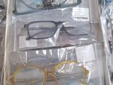 three pairs of glasses in a box on a table