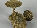 pair of antique brass candlesticks with ornate design
