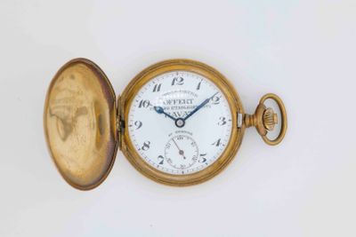 a gold pocket watch with a white face on a white surface