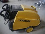 a yellow machine that is sitting on the floor