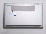 a laptop that has a broken battery on the back of it