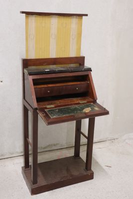 a wooden desk with a marble top on it