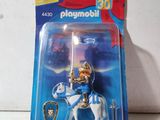 a toy figure of a knight on a horse