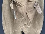 an old pair of pants hanging on a clothes line