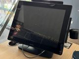 a tablet computer sitting on top of a wooden table