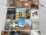 a box full of postcards sitting on top of a table