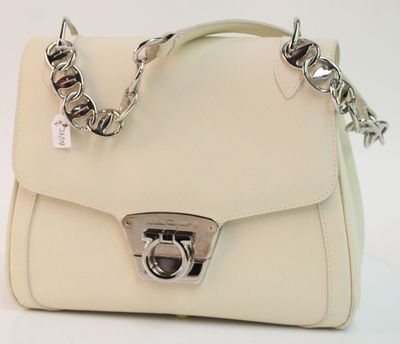 beige leather handbag with silver hardware and chain strap