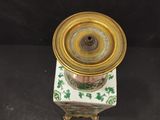 an image of a gold and green clock on a marble base