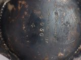 a close up of a metal object with a tag on it