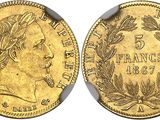 a gold coin with a woman ' s head and laurels on it