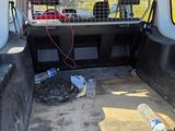 a car that has a cage in the back of it