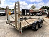 an image of a flatbed trailer parked in a parking lot