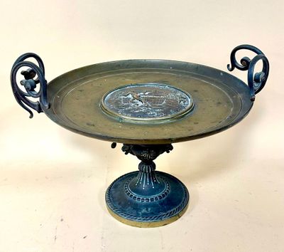 a metal tray with a decorative design on top of it