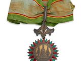 une image représentant une médaille avec un ruban sur fond blanc