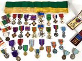 a lot of medals and medals on display on a table