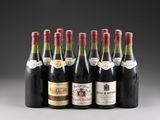 six bottles of wine are lined up in a row on a table