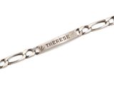a close up of a silver bracelet with a message on it