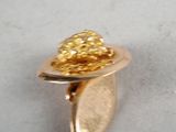 yellow gold plated ring with a leaf and a gold bead