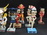 seven figurines of different characters on display